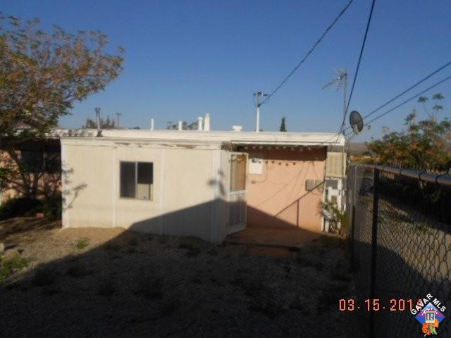 1233 South McCall Street Ridgecrest, CA 93555 - Photo 6 of 8 a view of a house with backyard