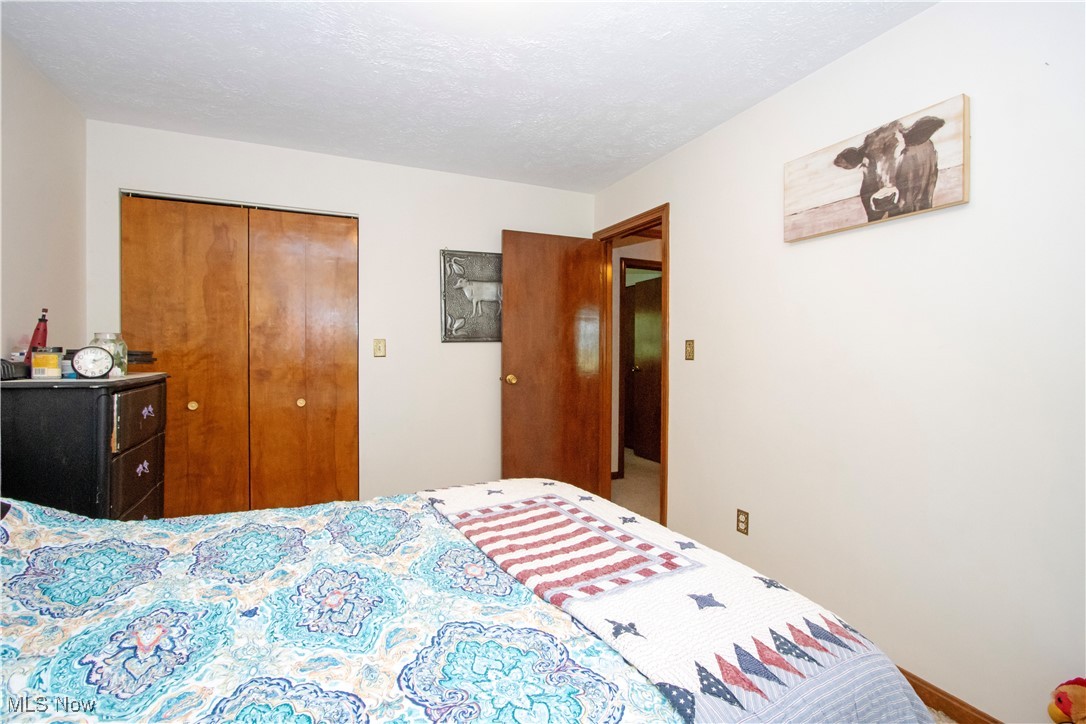 1292 Cinder Road Southeast Carrollton, OH 44615 - Photo 34 of 42 Bedroom with a closet
