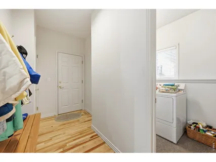 a view of an entryway with wooden floor