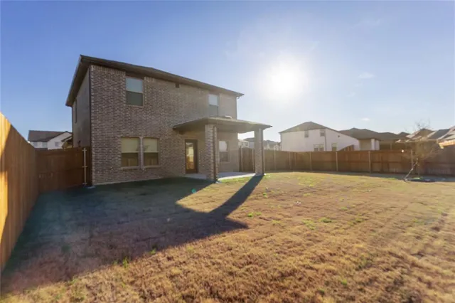 a house view with a backyard space