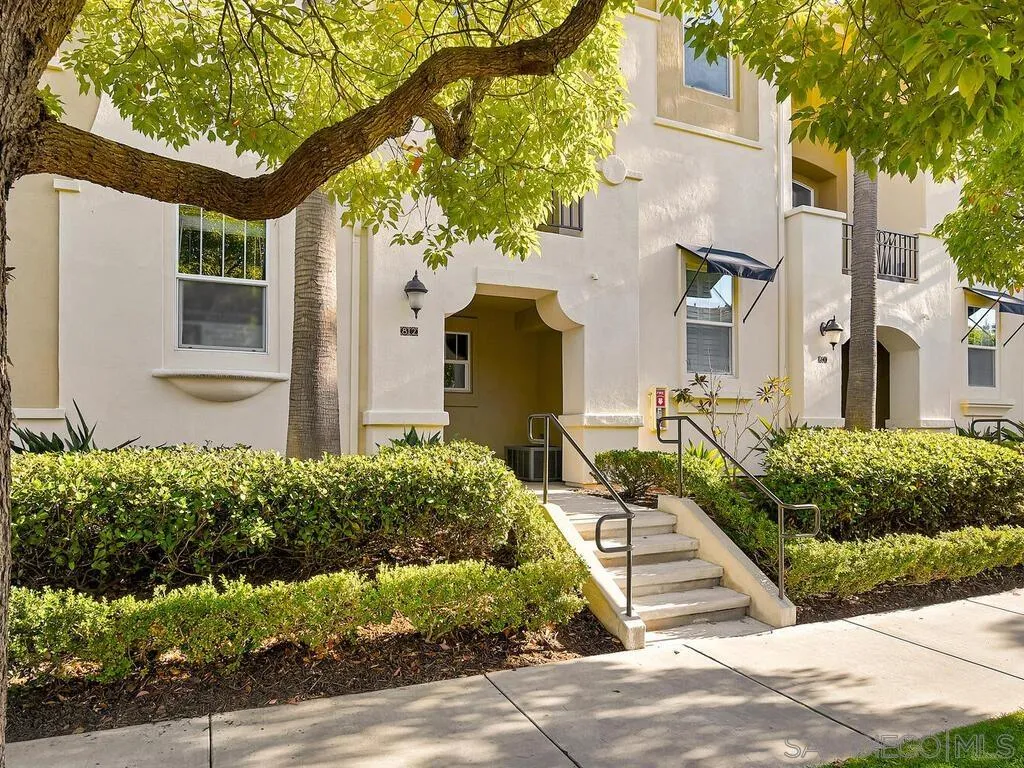 2249 Historic Decatur Road, Unit 82 San Diego, CA 92106 - Photo 1 of 37 a front view of a house with a yard and potted plants