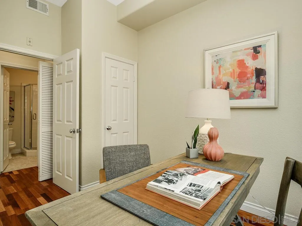 2249 Historic Decatur Road, Unit 82 San Diego, CA 92106 - Photo 16 of 37 a living room with furniture and wooden floor
