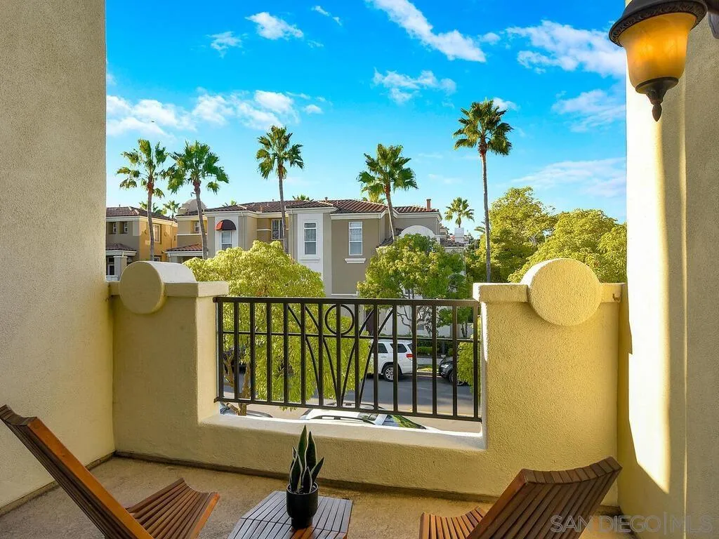 2249 Historic Decatur Road, Unit 82 San Diego, CA 92106 - Photo 7 of 37 a balcony with table and chairs