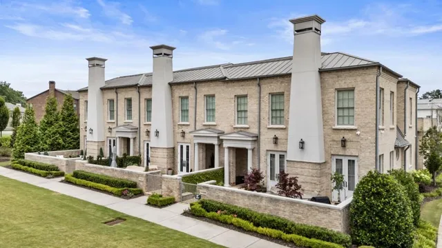 a front view of a building with garden