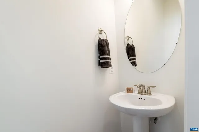 a bathroom with a sink and mirror
