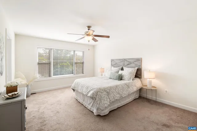 a bed room with a bed and a window