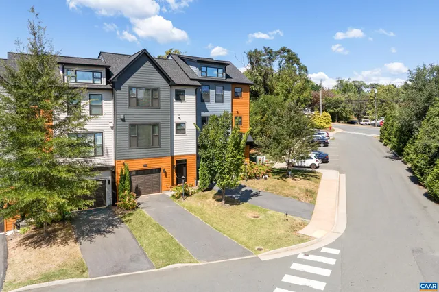 a view of a house with a small yard