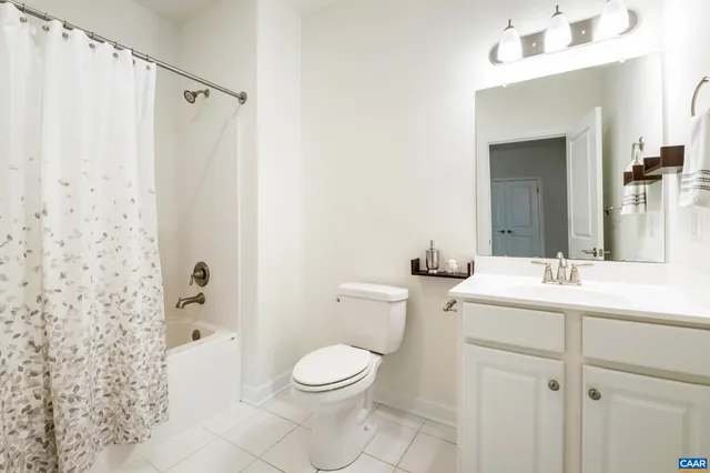 a view of a room with wooden floor and windows