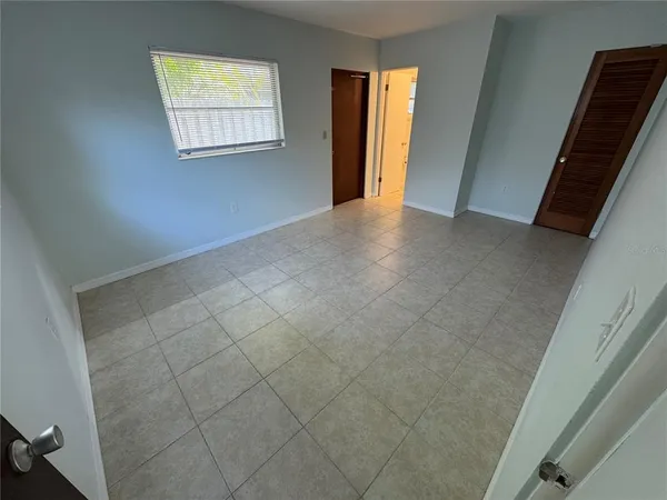a view of an empty room with a window