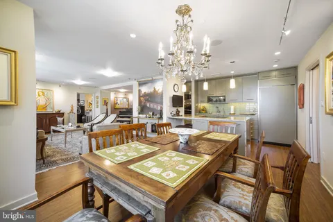 a kitchen with kitchen island a sink appliances and cabinets