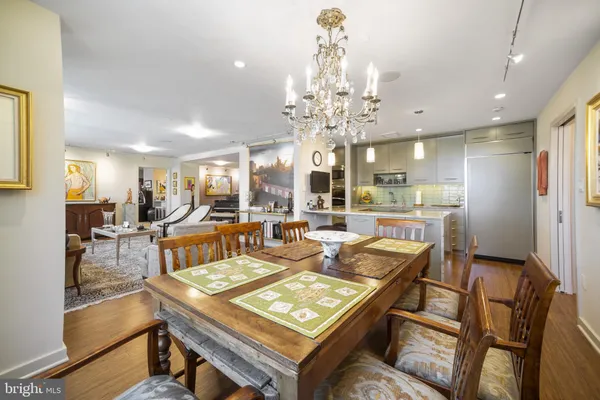 a kitchen with kitchen island a sink appliances and cabinets