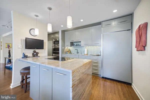 a kitchen with lots of counter space and window