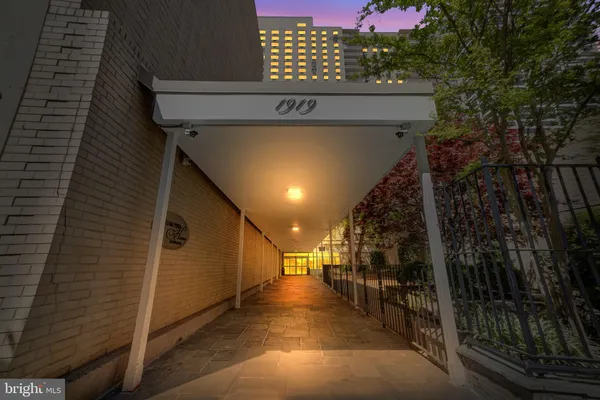 a view of a house with a tree