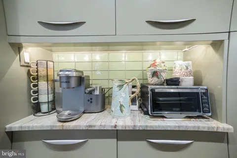 a view of a bathroom with toilet and a shower curtain