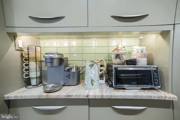 a view of a bathroom with toilet and a shower curtain