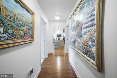 a spacious bedroom with a bed and a flat screen tv