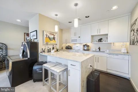 a kitchen with a stove sink and microwave