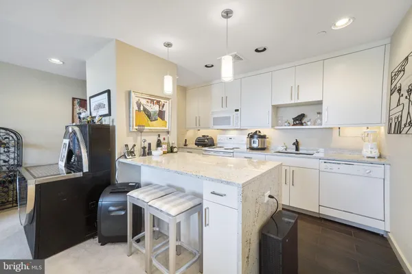 a kitchen with a stove sink and microwave