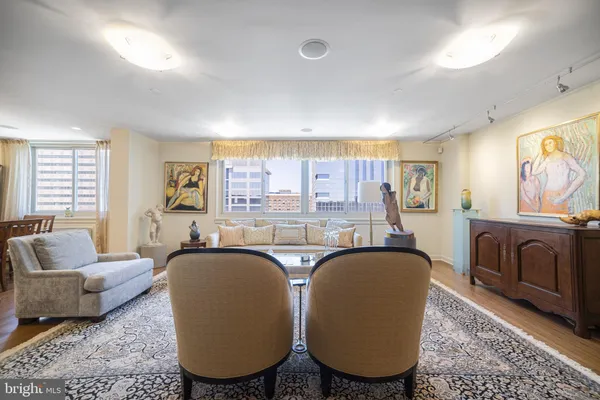 a living room with furniture and a large window