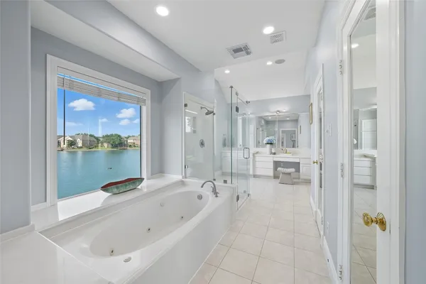 a bathroom with a bathtub and a shower