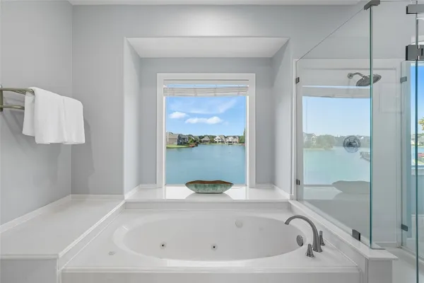 a bathroom with a double vanity sink mirror and toilet