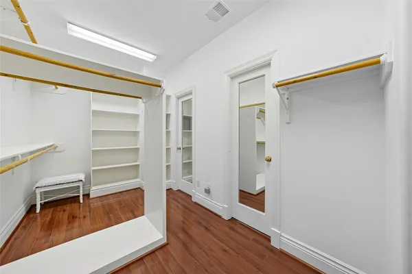 a view of a hallway view with wooden floor and staircase