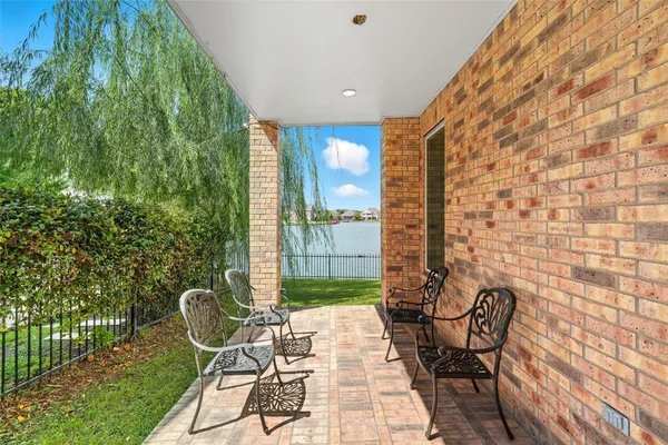 a bathroom with a granite countertop sink a toilet and a shower