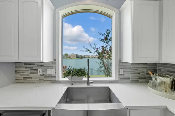 a kitchen with a sink and a window