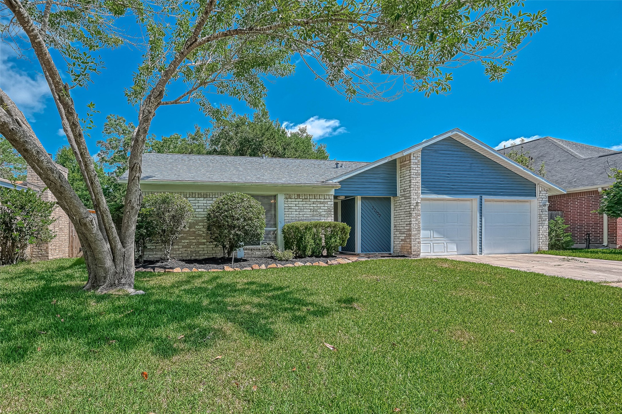 22622 John Rolfe Lane Katy, TX 77449 - Photo 2 of 21 a view of a house with a big yard and large tree