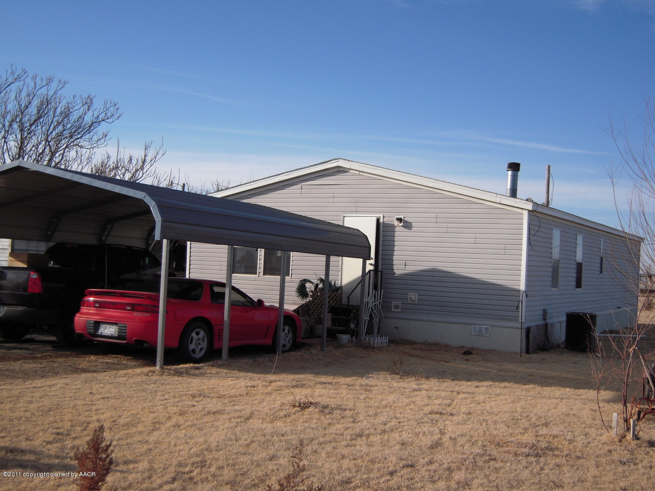 551 Chattanooga Road Amarillo, TX 79118 - Photo 4 of 17 a front view of a house with a garden and parking space
