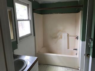 93 Dover Road Mashpee, MA 02649 - Photo 12 of 21 a bathroom with a granite countertop bathtub sink and toilet