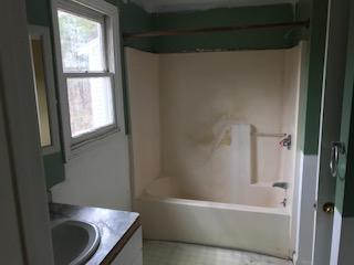 93 Dover Road Mashpee, MA 02649 - Photo 13 of 21 a bathroom with a granite countertop bathtub sink and toilet
