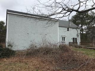 93 Dover Road Mashpee, MA 02649 - Photo 19 of 21 a backyard of a house with lots of green space