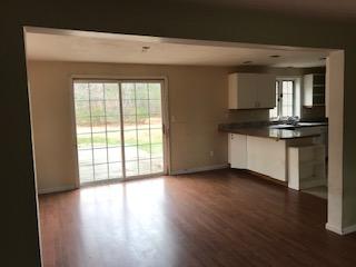 93 Dover Road Mashpee, MA 02649 - Photo 2 of 21 a view of a kitchen with wooden floor and a window