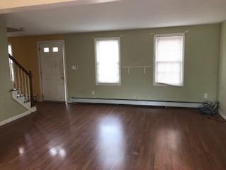 93 Dover Road Mashpee, MA 02649 - Photo 4 of 21 an empty room with wooden floor and windows