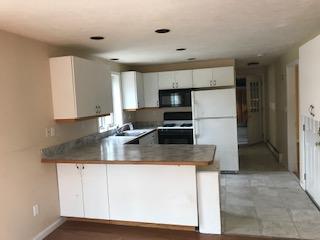 93 Dover Road Mashpee, MA 02649 - Photo 5 of 21 a kitchen with kitchen island a counter top space cabinets and stainless steel appliances