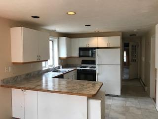 93 Dover Road Mashpee, MA 02649 - Photo 6 of 21 a kitchen with stainless steel appliances granite countertop a sink a refrigerator and a stove