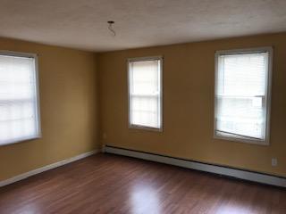 93 Dover Road Mashpee, MA 02649 - Photo 7 of 21 a view of an empty room with wooden floor and a window