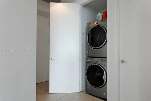 a bedroom with a bed and a lamp