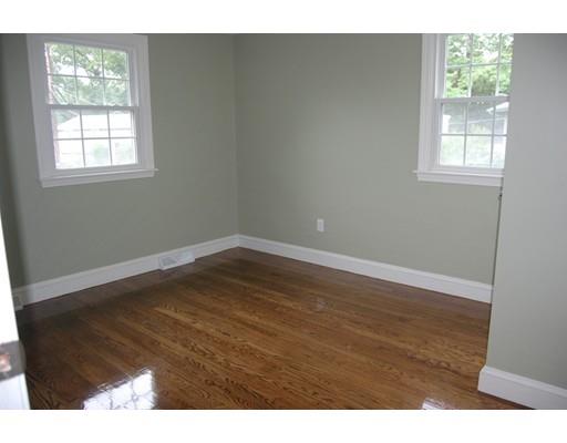 5 Westgate Road Framingham, MA 01701 - Photo 6 of 14 an empty room with wooden floor and windows