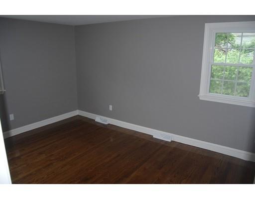 5 Westgate Road Framingham, MA 01701 - Photo 7 of 14 a view of an empty room with wooden floor and a window