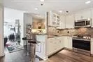 a kitchen with stainless steel appliances granite countertop a sink and a stove top oven