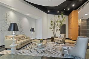 3338 Peachtree Road Northeast, Unit 1905 Atlanta, GA 30326 - Photo 14 of 19 a living room with furniture and wooden floor