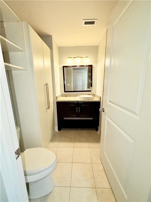 3338 Peachtree Road Northeast, Unit 1905 Atlanta, GA 30326 - Photo 8 of 25 a bathroom with a toilet and a sink