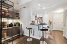 3338 Peachtree Road Northeast, Unit 1905 Atlanta, GA 30326 - Photo 9 of 25 a view of a living room and kitchen