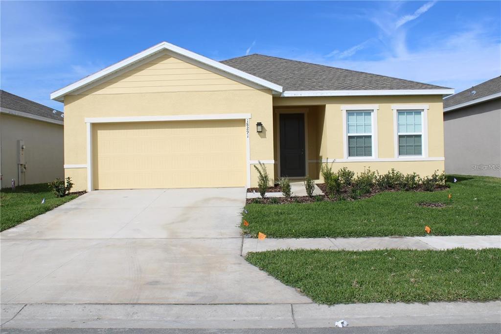 18291 Falling Pine Land O Lakes, FL 34638 - Photo 1 of 1 a front view of a house with a yard