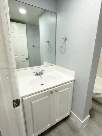 a bathroom with a toilet and a bathtub