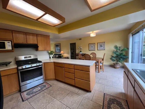 a kitchen with sink and cabinets