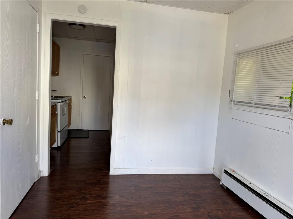 4401 4th Avenue, Unit F Beaver Falls, PA 15010 - Photo 3 of 6 an empty room with wooden floor and closet