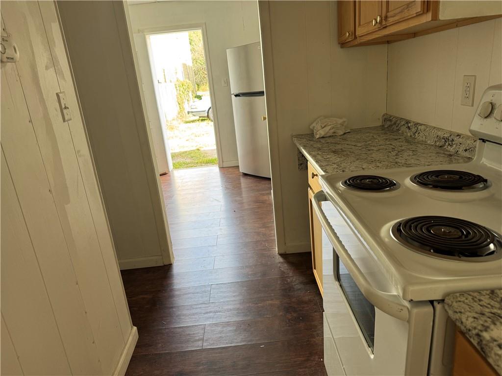 4401 4th Avenue, Unit F Beaver Falls, PA 15010 - Photo 5 of 6 a kitchen with a stove and a refrigerator